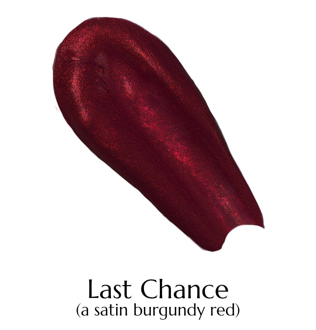 Satin burgundy red lipstick swatch labeled 'Last Chance' on a white background