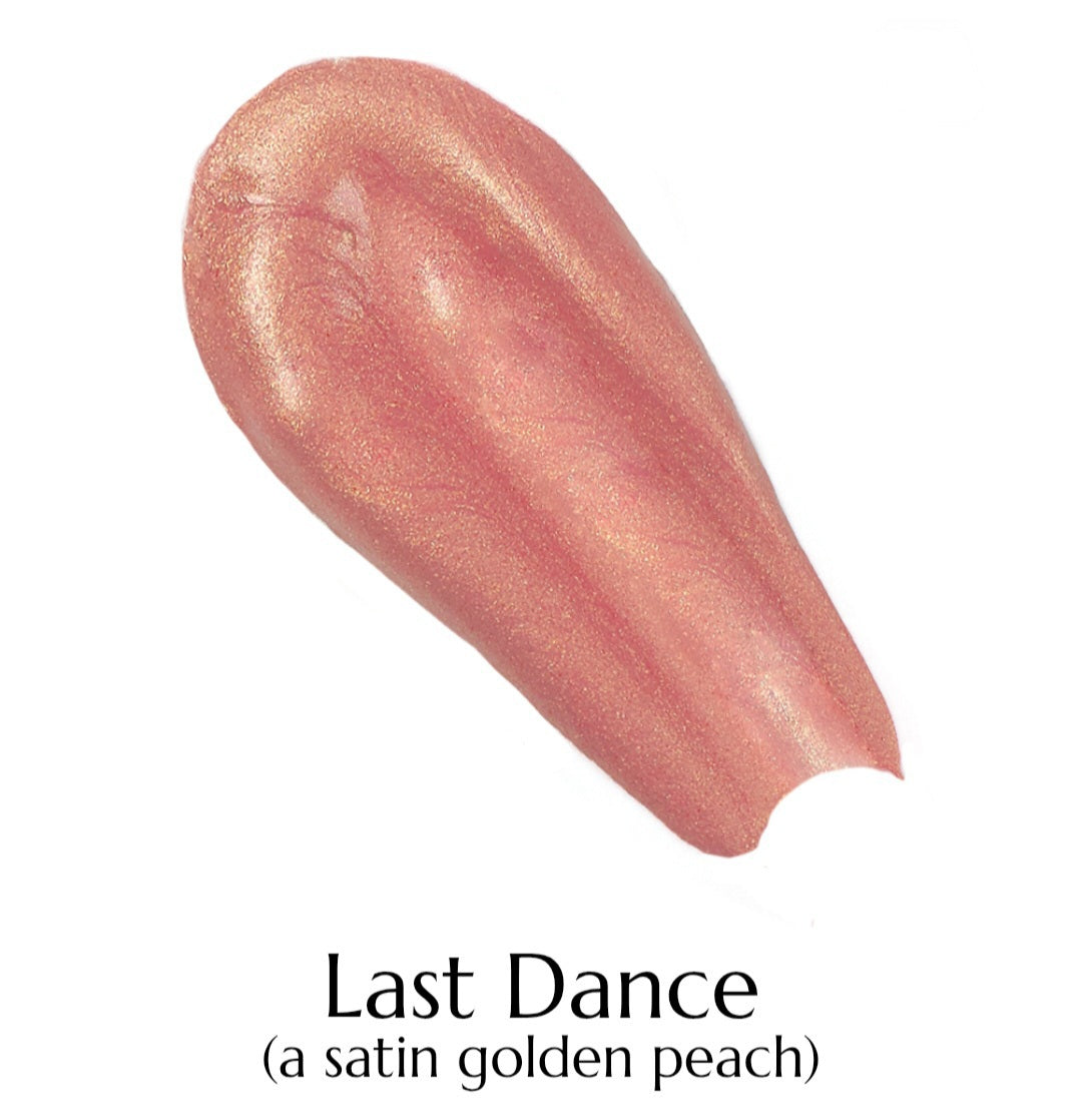 Lipstick swatch labeled 'Last Dance' in satin golden peach color on a white background